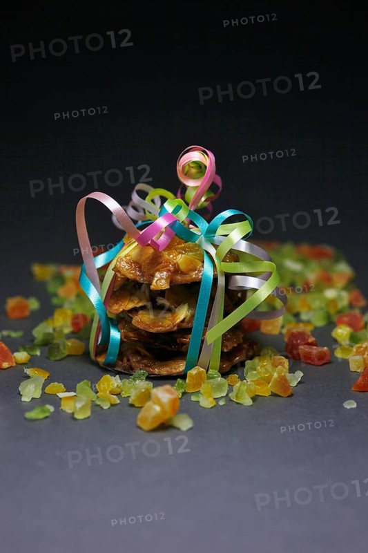 Candied orange peel and biscuits wrapped with a ribbon