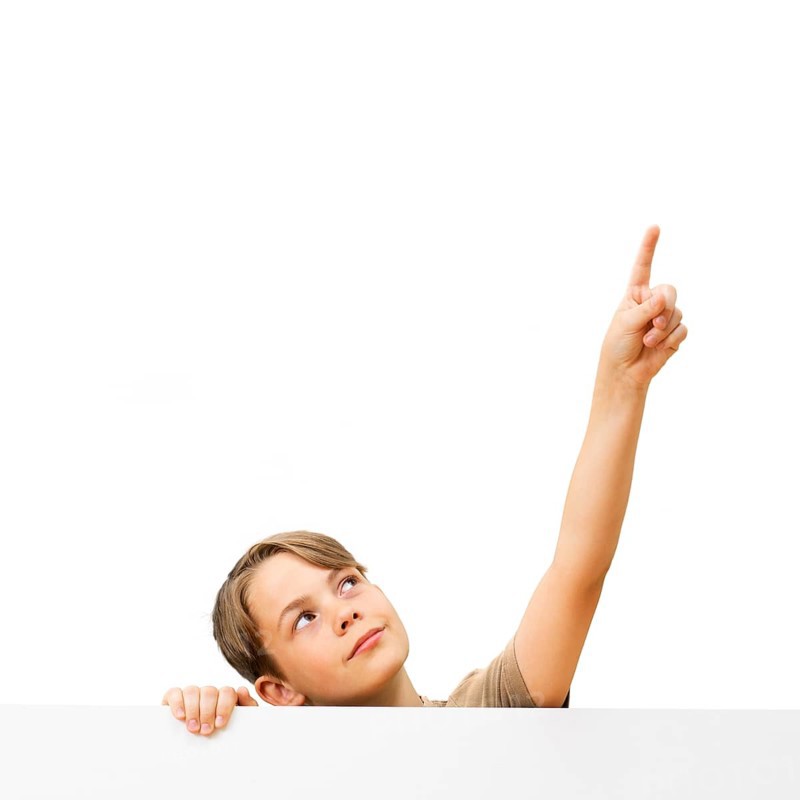 Schoolboy behind a white board