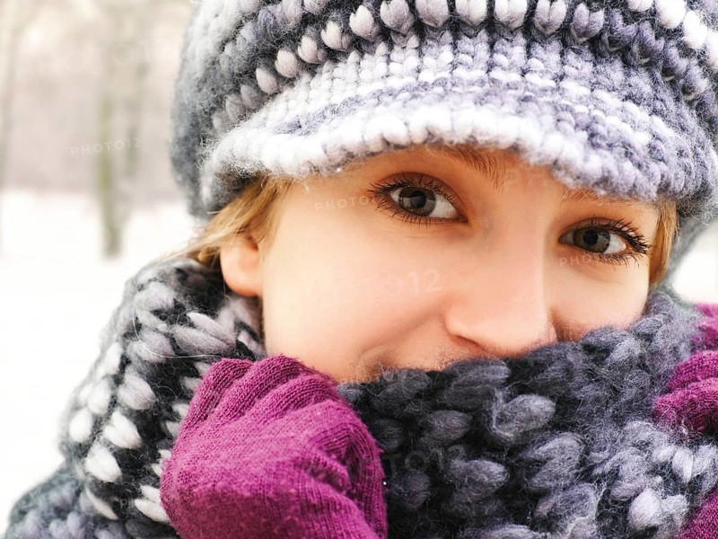 Girl wearing a hat and a scarf