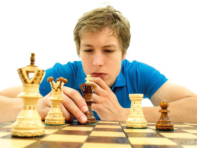 Young man playing chess