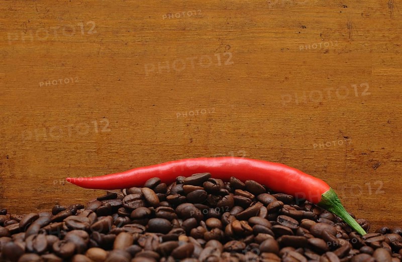 Red pepper on coffee beans