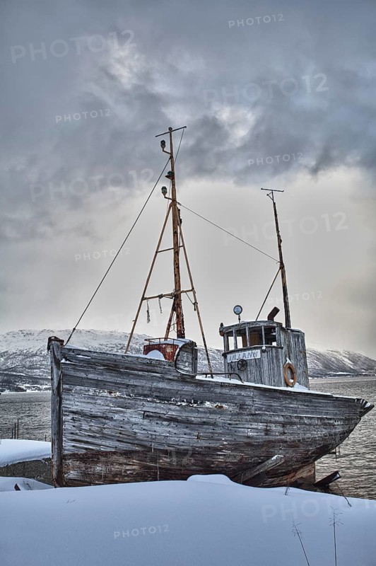 Old fishing boat in winter