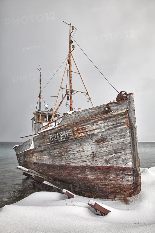 Old fishing boat in winter
