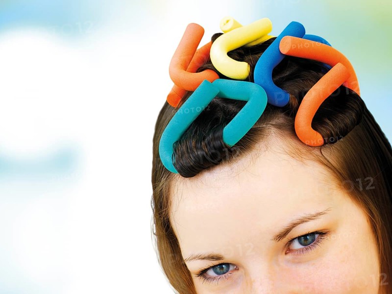 Young girl with soft-curl papillotes in her hair