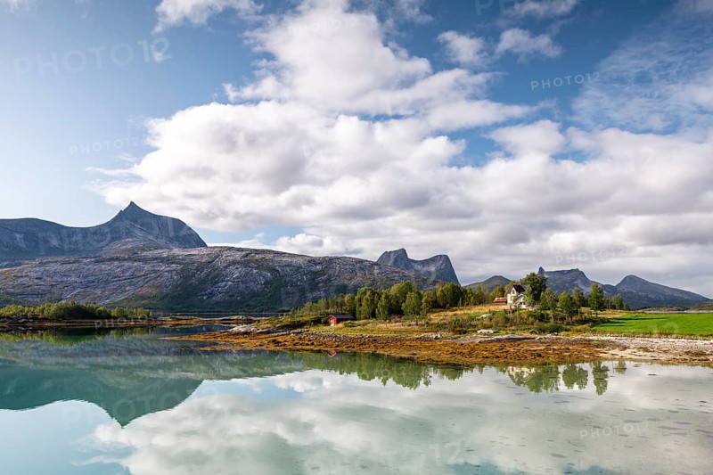 Mountains and landscape reflected in fjord