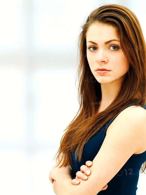 Young woman with her arms crossed