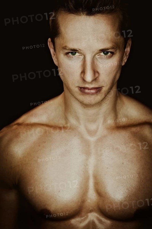 Young man with a muscular upper body