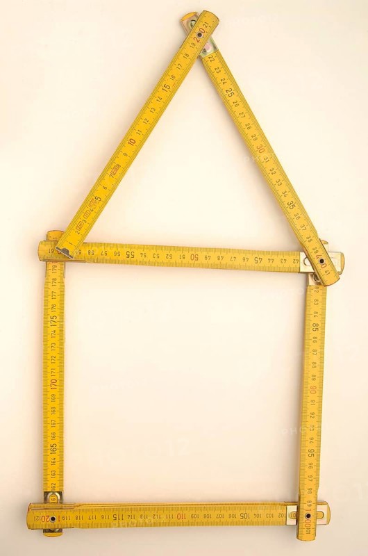Folding rule in the shape of a house