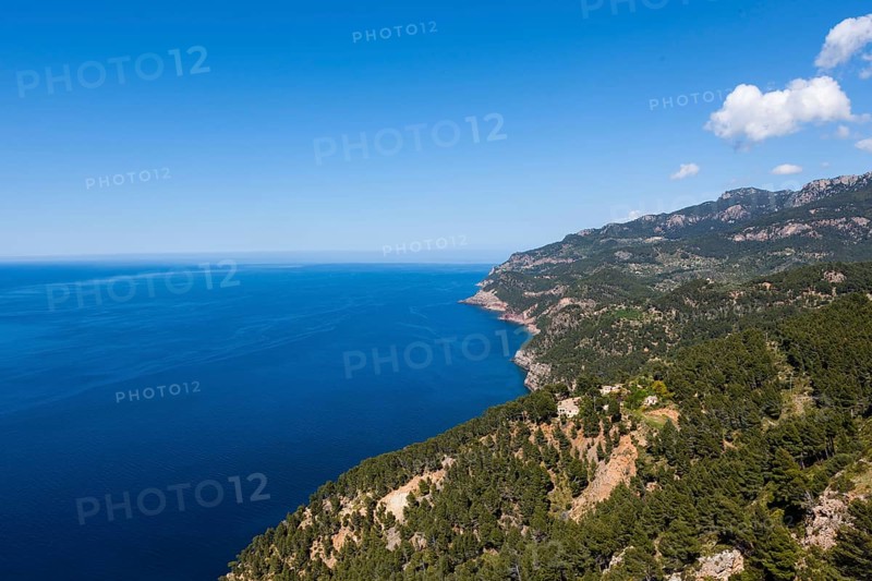 View of the cliffs with a remote house near Estellencs