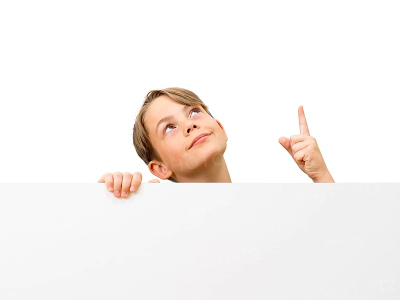 Schoolboy behind a white board
