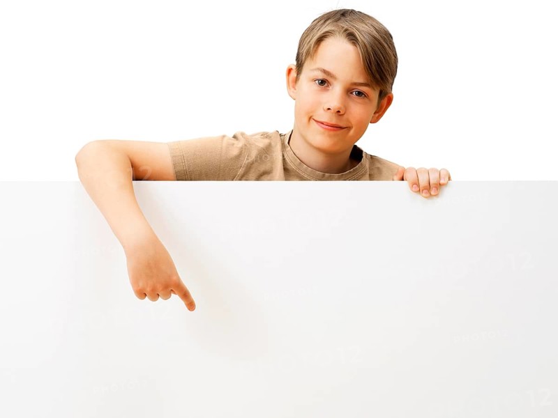 Schoolboy behind a white board