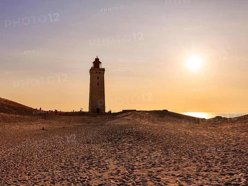 Lighthouse on the moving dune Rubjerg Knude at sunset