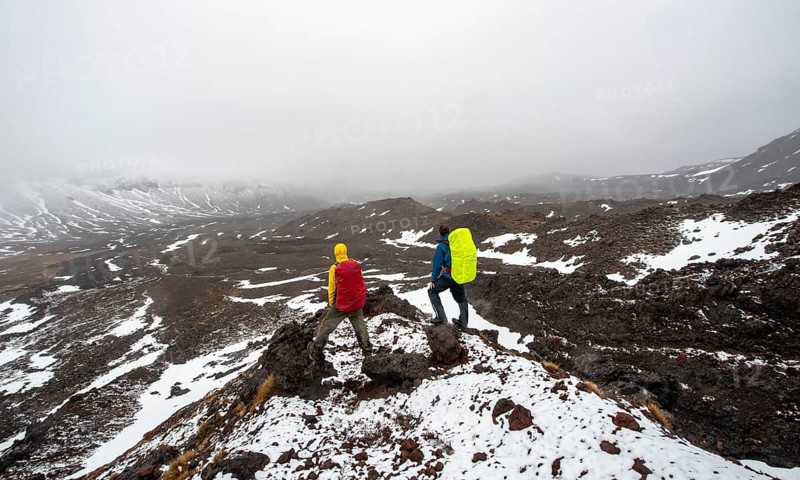 Hikers standing on stones