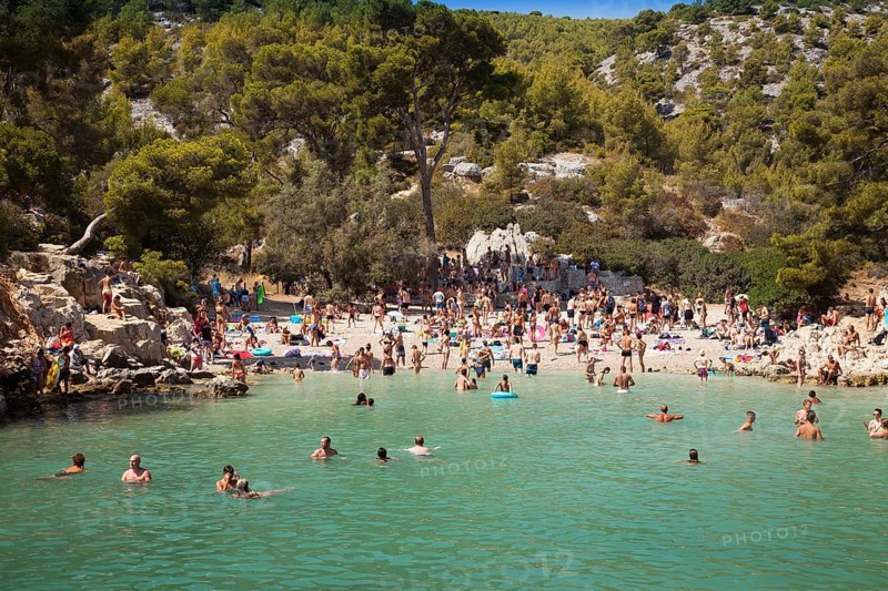 Beach vacationers at the beach in the bay Calanque de Port-Pin