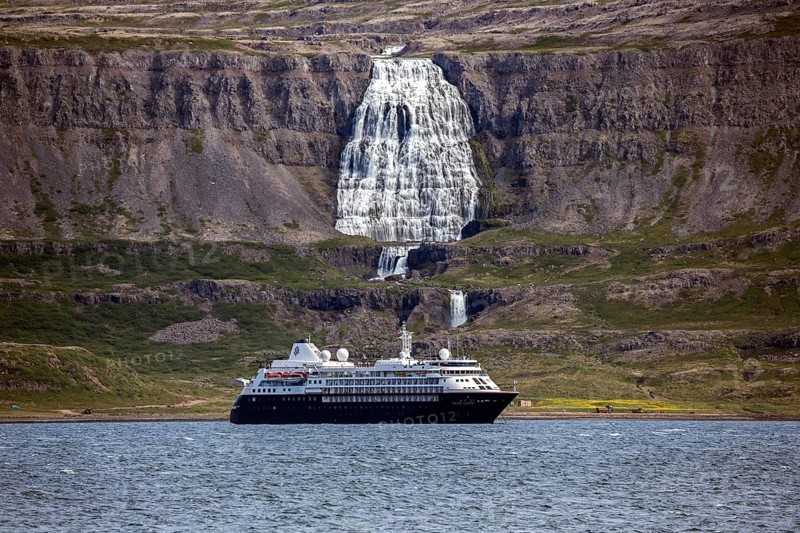 Cruise ship anchored in a fjord