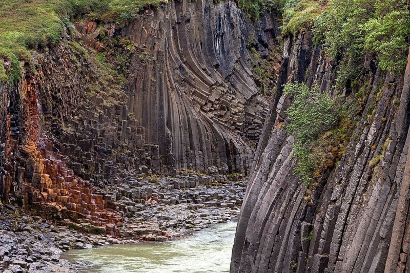 Studlagil gorge with basalt columns and glacial river Jokulsa a Bru