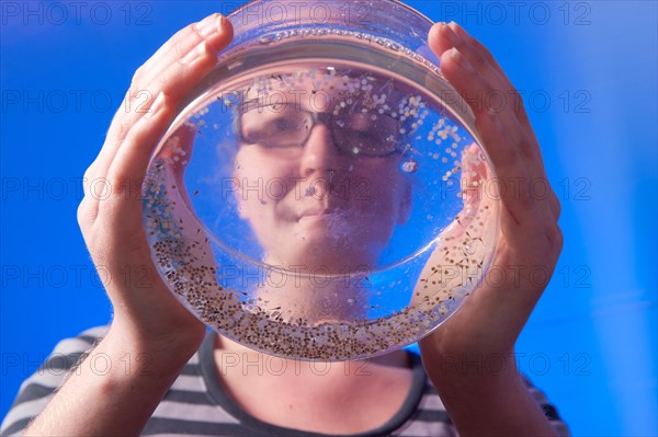 Woman conducting research in an aquaculture lab