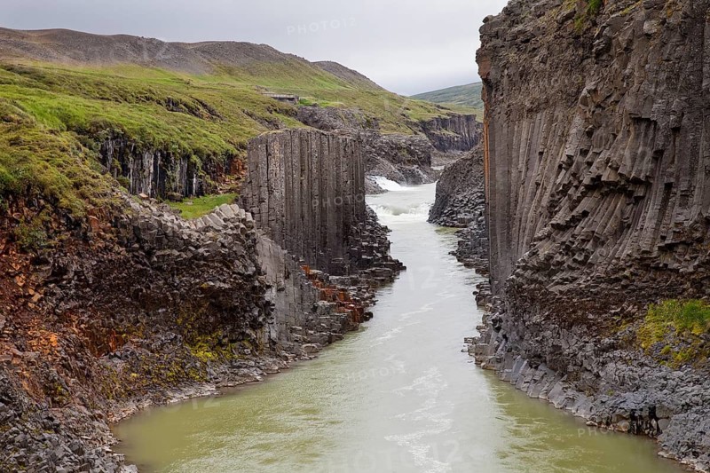 Studlagil gorge with basalt columns and glacial river Jokulsa a Bru