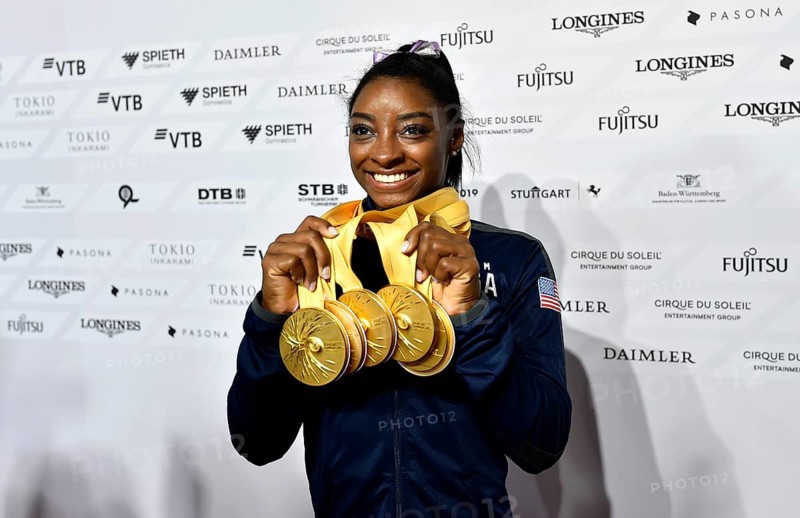 Simone Biles USA presents her 5 gold medals of the World Championships in Gymnastics