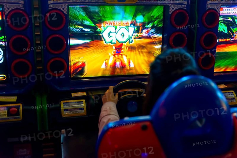 Teenager plays a car racing game