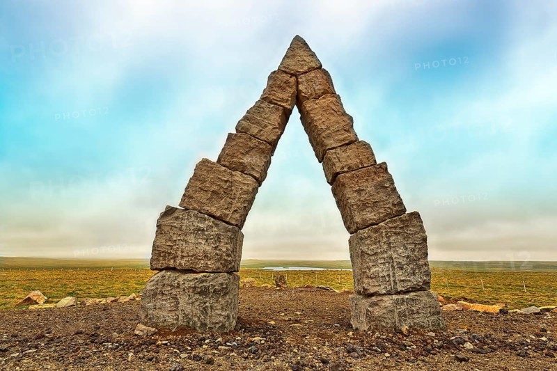 Monumental stone gate in barren landscape