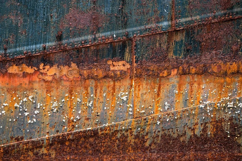 Rusty hull with barnacles