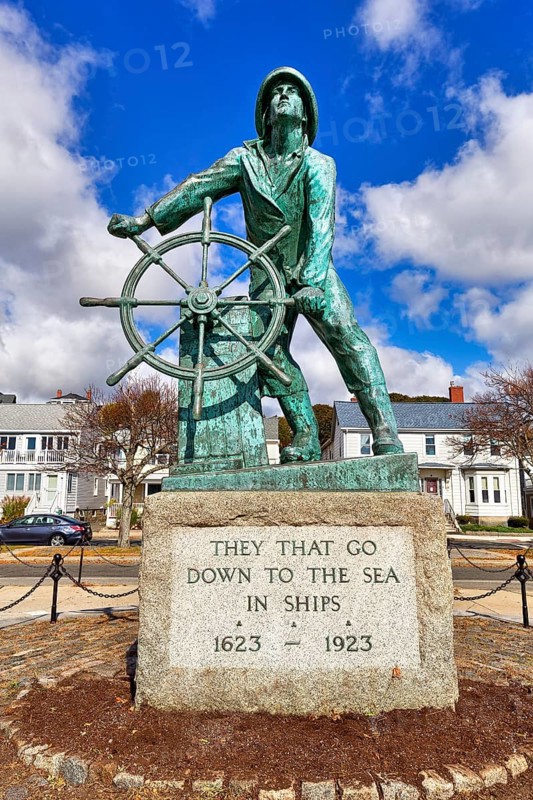 Bronze statue of a man at the wheel