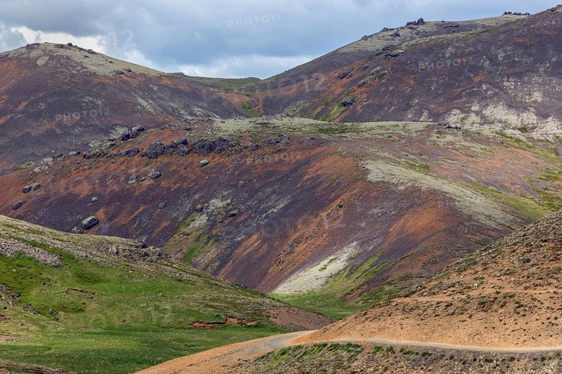 Barren volcanic landscape on the hiking trail to Reykjadalur