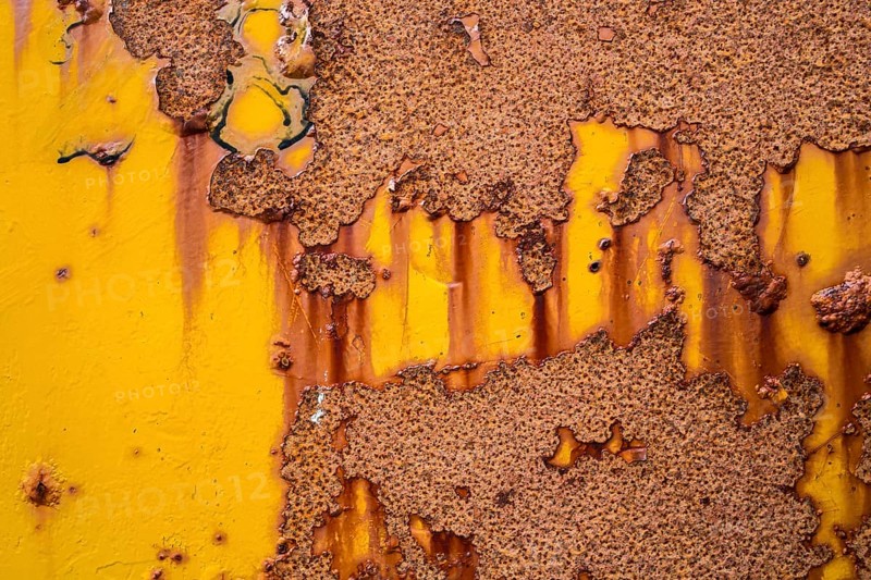 Rust on yellow metal wall
