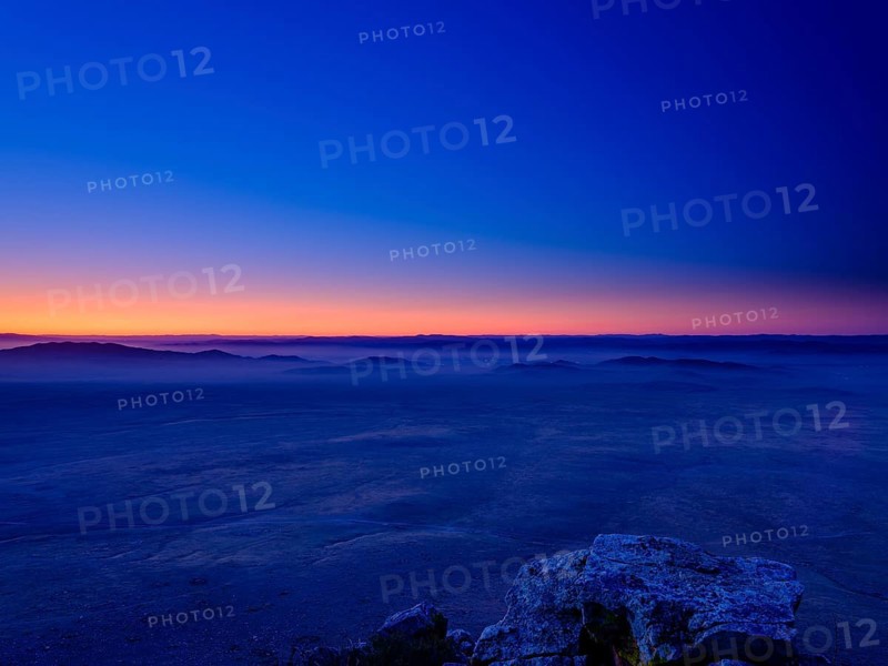 View from a summit to Mongolian steppe at blue hour