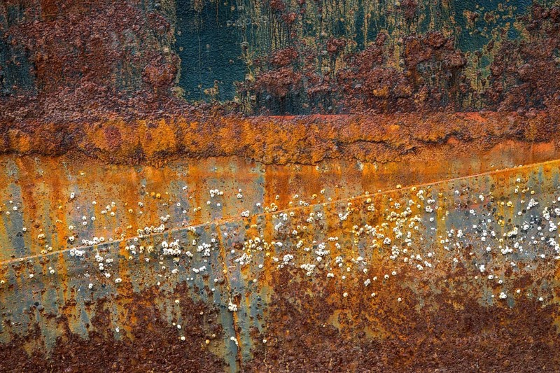 Rusty hull with barnacles