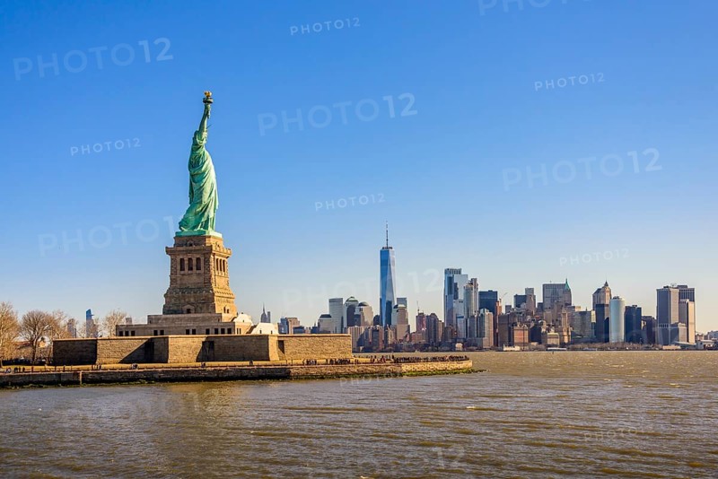 Statue of Liberty in front of Manhattan skyline