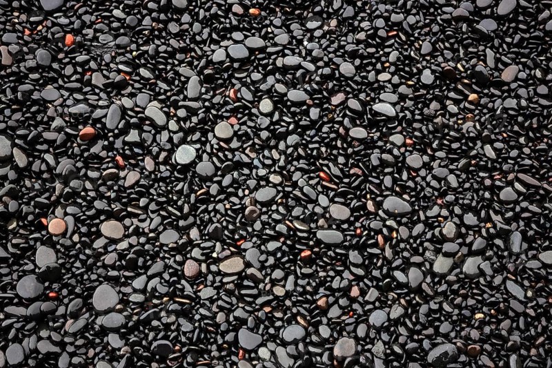 Black lava pebbles at Reynisfjara Beach