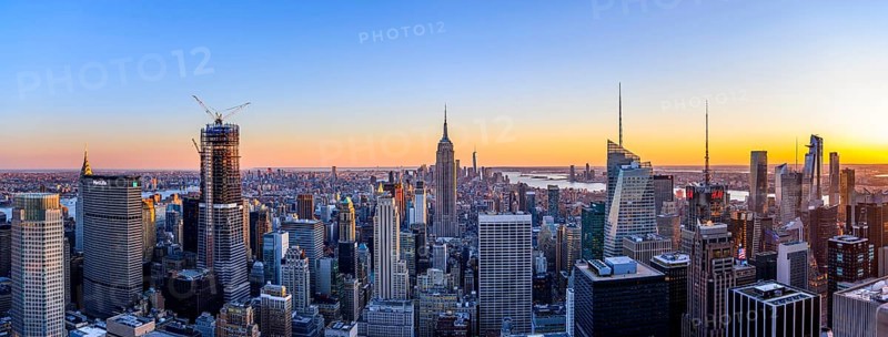 View of Midtown and Downtown Manhattan and Empire State Building from Top of the Rock Observation Center at sunset