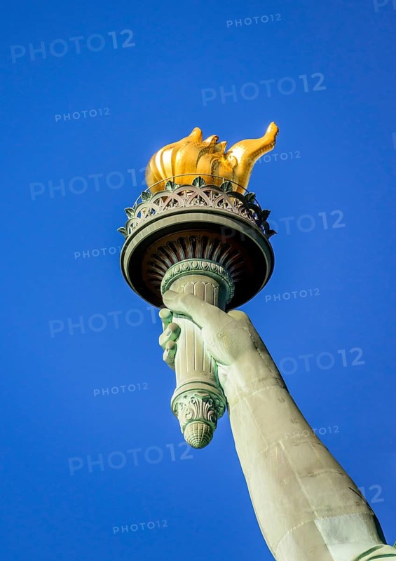 Hand with golden torch