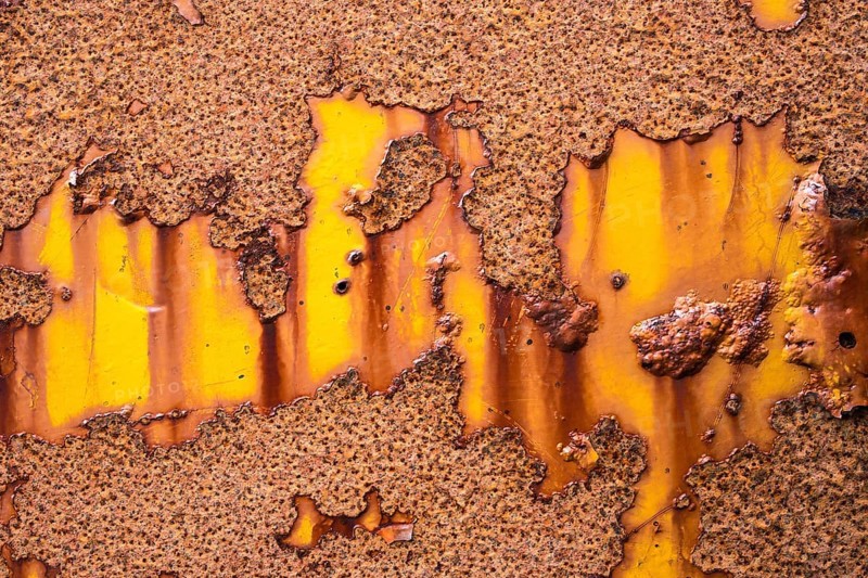 Rust on yellow metal wall