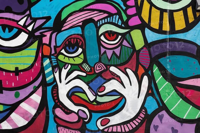 Colourful face with hand signal heart