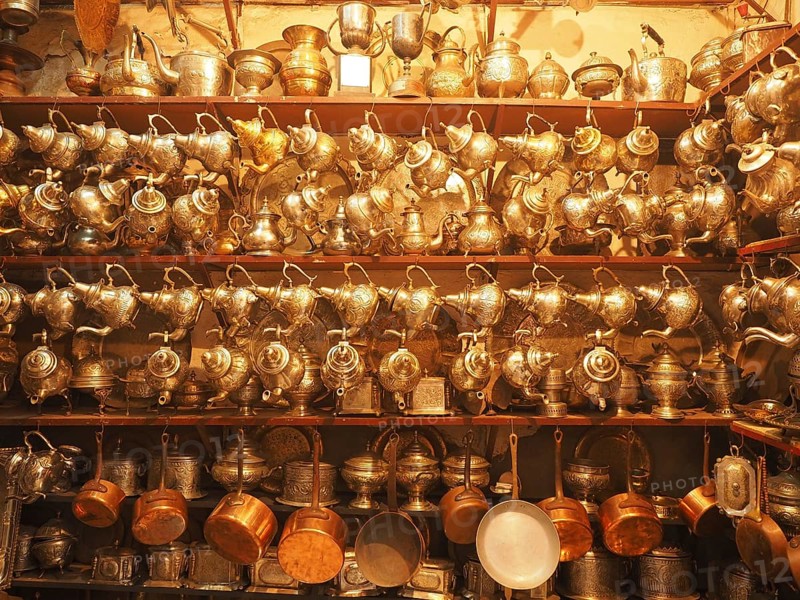 Shop with traditional silver and brass crockery