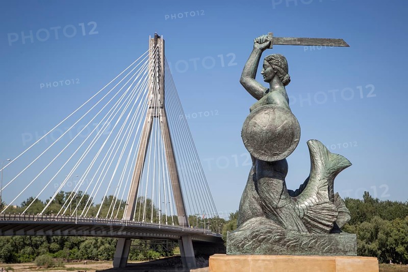 Bronze sculpture of the Warsaw mermaid on the bank of the Vistula River