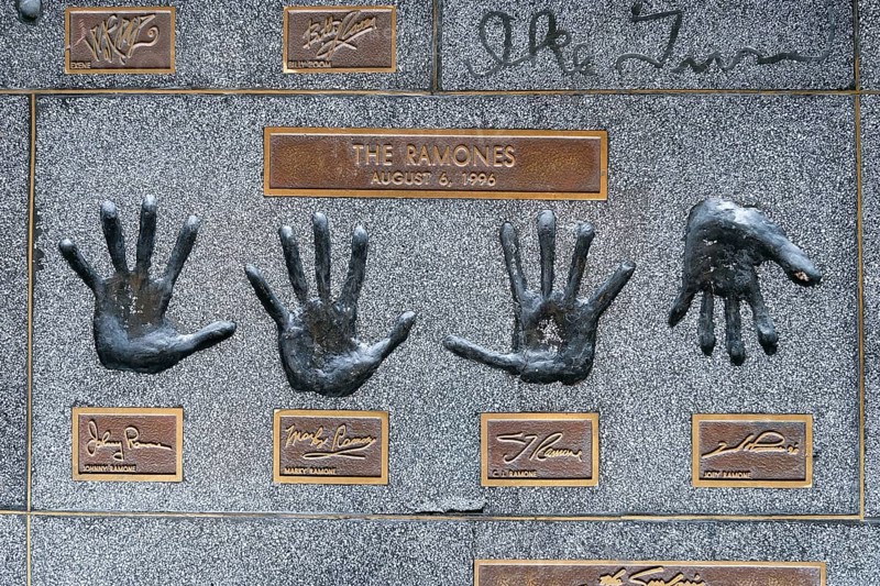 Hands of the band The Ramones with JohnnyMarky