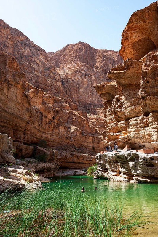 Freshwater pool between rugged cliffs