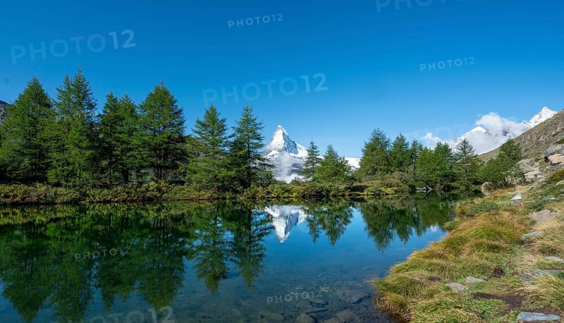 Snow-covered Matterhorn reflected in the lake