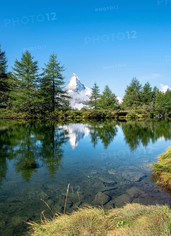 Snow-covered Matterhorn reflected in the lake