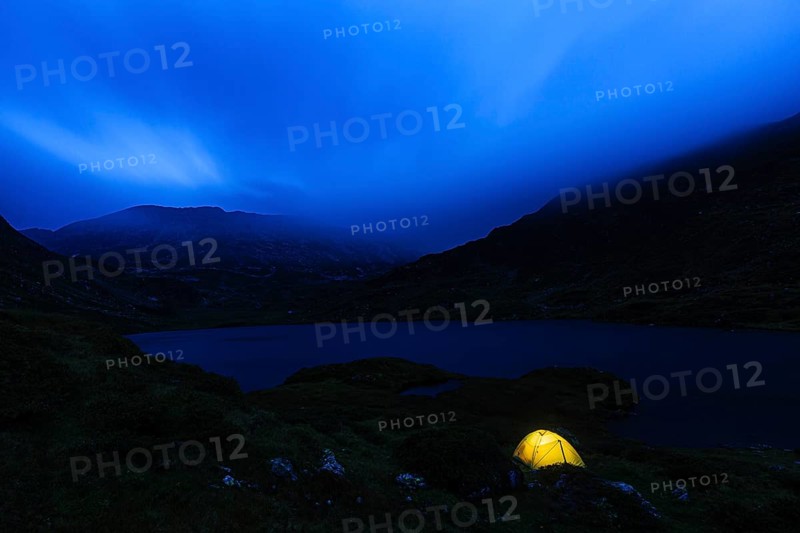 Illuminated tent at night