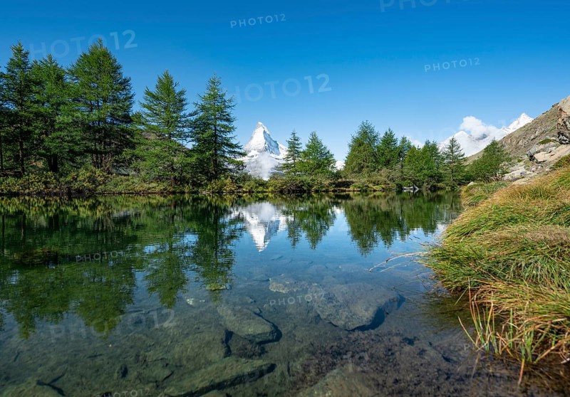 Snow-covered Matterhorn reflected in the lake