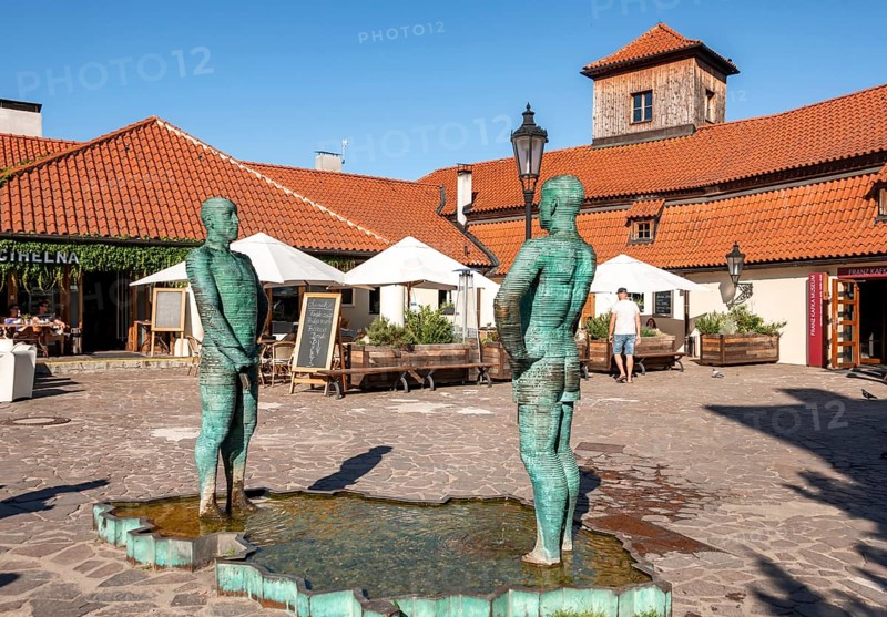 Two male figures peeing