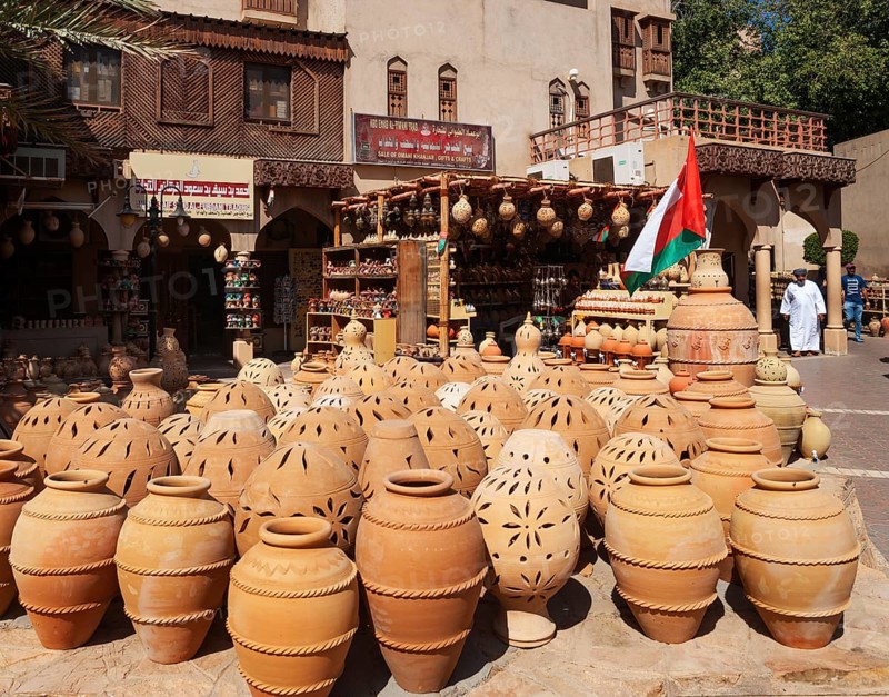 Clay jugs in front of souvenir shops