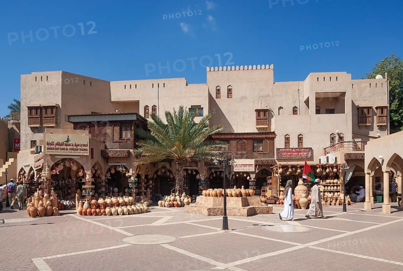 Clay jugs in front of souvenir shops