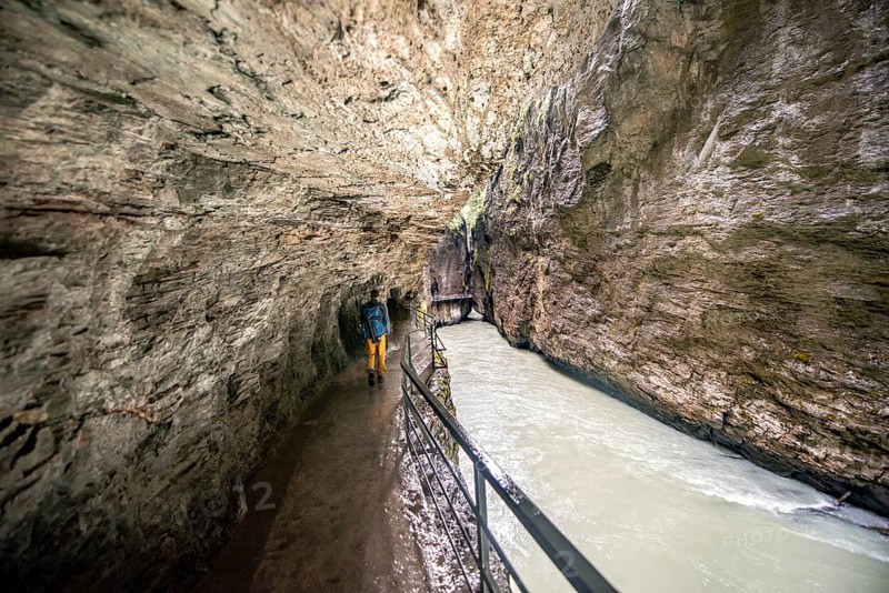 Young man in the Aareschlucht gorge in the Haslital