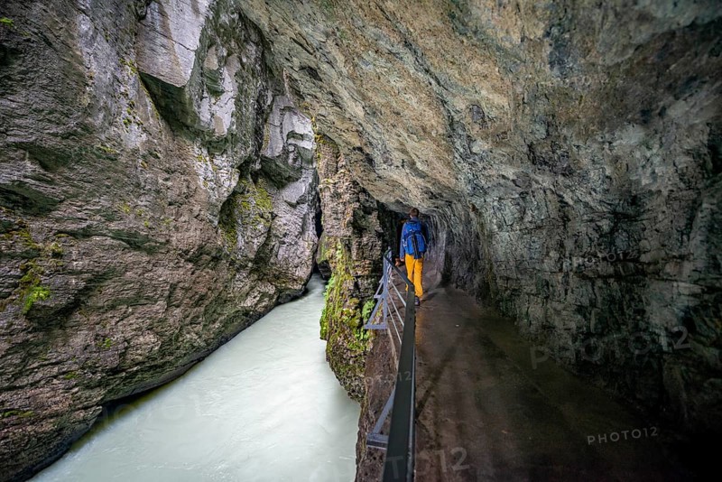 Young man hiking in the Aare gorge in the Haslital